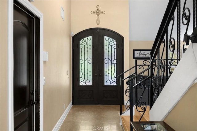 2405 E Alicia St, West Covina, CA 91792 - entrance foyer featuring arched walkways, french doors, and stairway