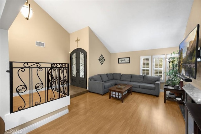 2405 E Alicia St, West Covina, CA 91792 - living room featuring high vaulted ceiling and wood finished floors