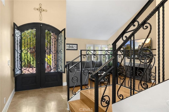 2405 E Alicia St, West Covina, CA 91792 - foyer with french doors, vaulted ceiling, and tile patterned flooring