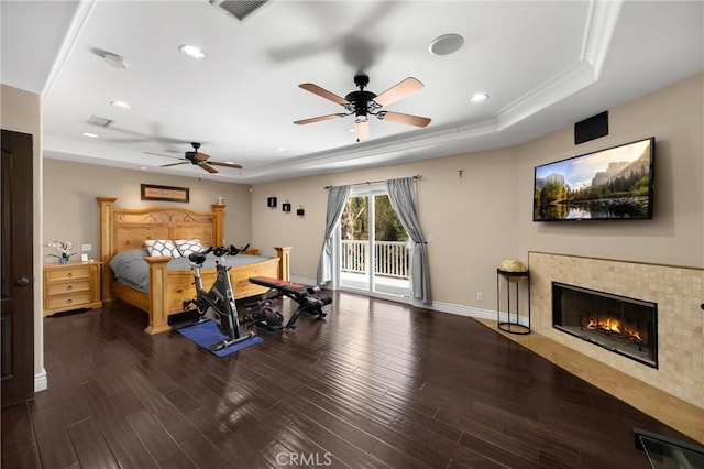 2405 E Alicia St, West Covina, CA 91792 - bedroom featuring a tray ceiling, access to exterior, wood finished floors, a fireplace, and recessed lighting