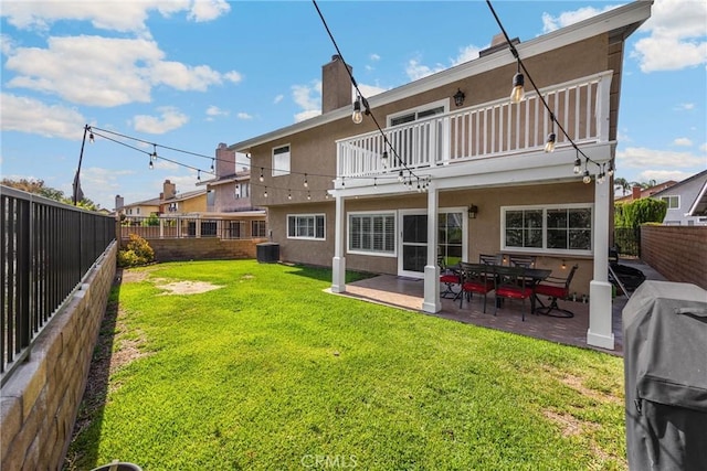 2405 E Alicia St, West Covina, CA 91792 - rear view of house with a balcony, a fenced backyard, stucco siding, and a patio area