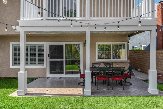 2405 E Alicia St, West Covina, CA 91792 - back of house featuring a balcony, stucco siding, a patio, and outdoor dining space
