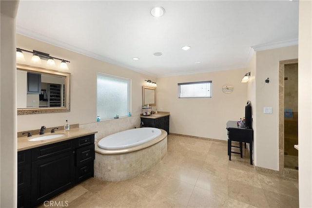2405 E Alicia St, West Covina, CA 91792 - bathroom with ornamental molding, a bath, two vanities, tiled shower, and recessed lighting