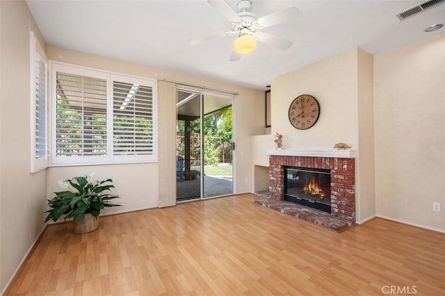 41791 Corte Lara, Temecula, CA 92592 - unfurnished living room featuring wood finished floors, a brick fireplace, and a ceiling fan