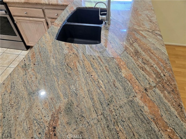 41791 Corte Lara, Temecula, CA 92592 - kitchen view of stainless steel electric range oven and light stone countertops