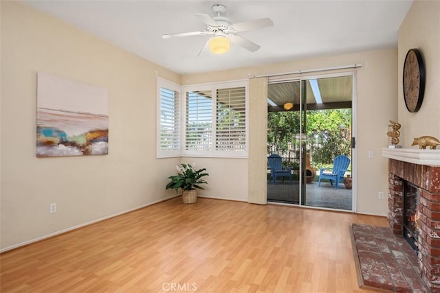 41791 Corte Lara, Temecula, CA 92592 - living area featuring wood finished floors, a fireplace, and a ceiling fan