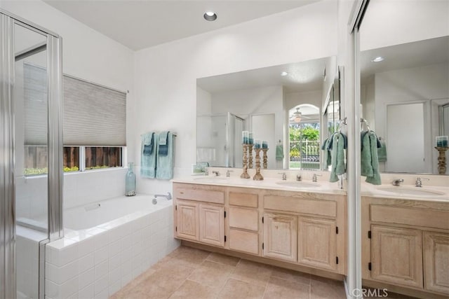 41791 Corte Lara, Temecula, CA 92592 - bathroom featuring double vanity, a garden tub, tile patterned flooring, and recessed lighting