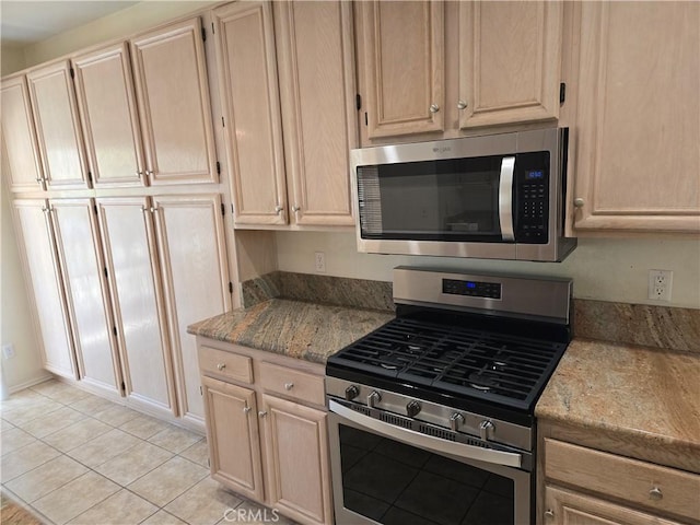 41791 Corte Lara, Temecula, CA 92592 - kitchen with appliances with stainless steel finishes, light brown cabinets, light tile patterned floors, and light stone countertops