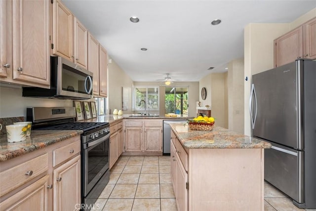 41791 Corte Lara, Temecula, CA 92592 - kitchen with stainless steel appliances, light brown cabinets, light tile patterned floors, a kitchen island, and recessed lighting