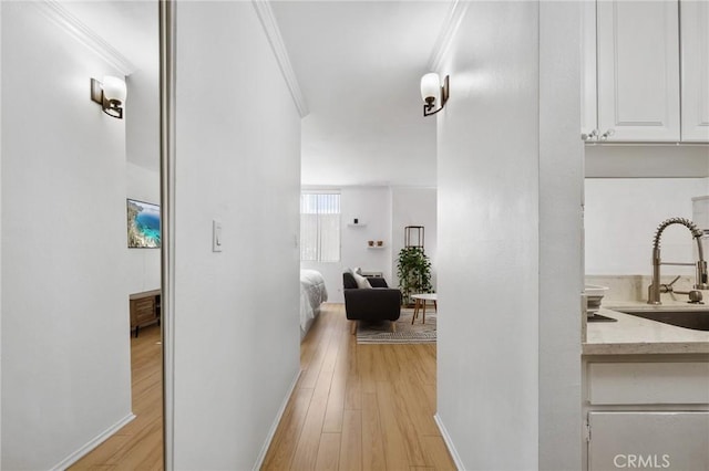 525 S Ardmore Ave Unit 257, Los Angeles, CA 90020 - corridor with light wood-style flooring and crown molding