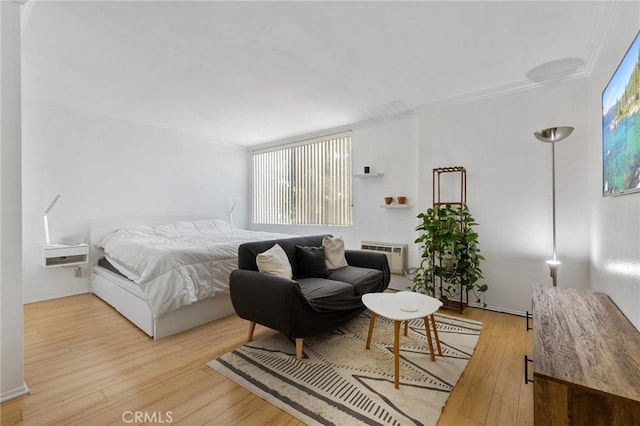 525 S Ardmore Ave Unit 257, Los Angeles, CA 90020 - bedroom featuring a wall mounted air conditioner, wood finished floors, and ornamental molding
