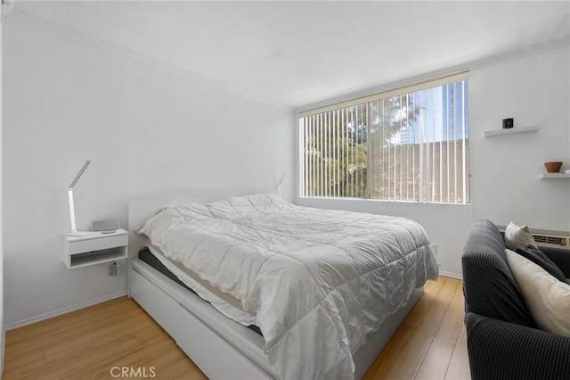 525 S Ardmore Ave Unit 257, Los Angeles, CA 90020 - bedroom with light wood-type flooring and crown molding