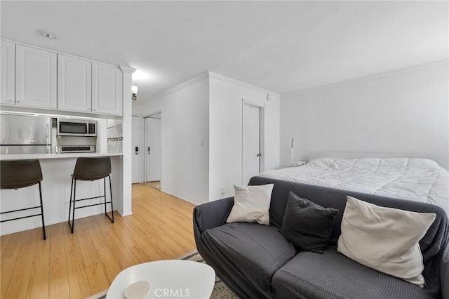 525 S Ardmore Ave Unit 257, Los Angeles, CA 90020 - living area with crown molding and light wood-style flooring