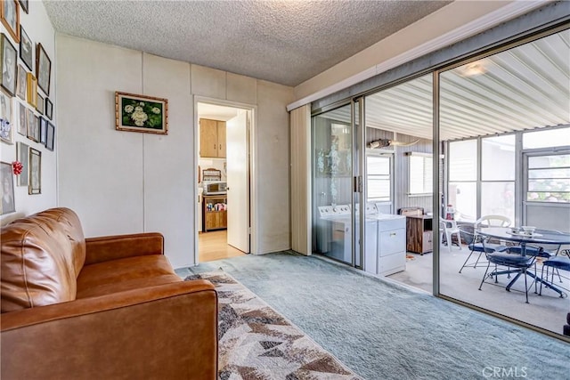 4750 W 191st St, Torrance, CA 90503 - living area featuring washing machine and dryer, light carpet, and a textured ceiling