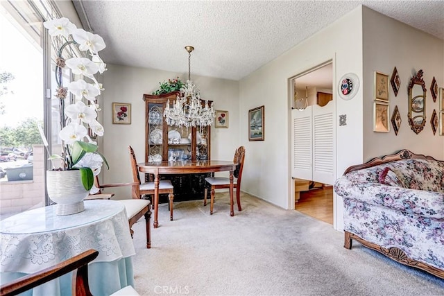4750 W 191st St, Torrance, CA 90503 - dining area with a textured ceiling, carpet floors, and a chandelier