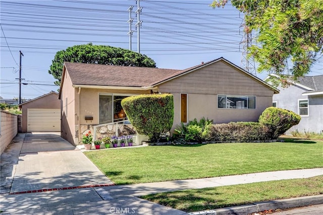 4750 W 191st St, Torrance, CA 90503 - view of front of house with stucco siding, a front yard, an outdoor structure, and a garage