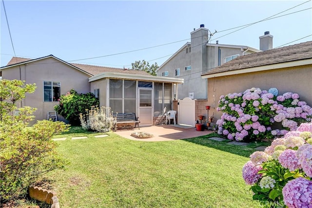 4750 W 191st St, Torrance, CA 90503 - rear view of property with a sunroom, a yard, a patio, and stucco siding