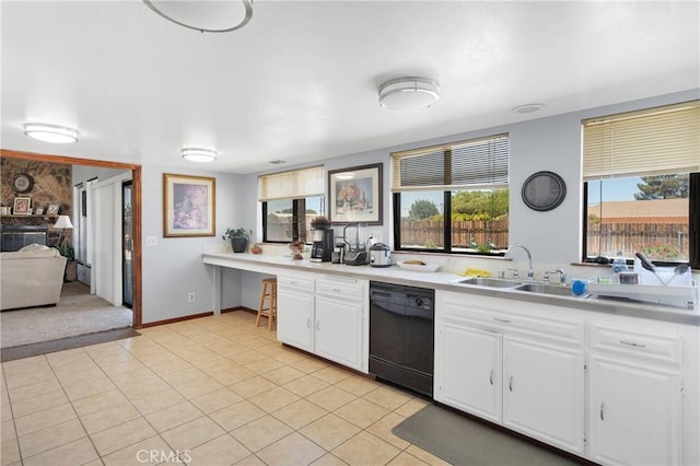 19678 Red Feather Rd, Apple Valley, CA 92307 - kitchen with dishwasher, light countertops, white cabinets, and light tile patterned flooring
