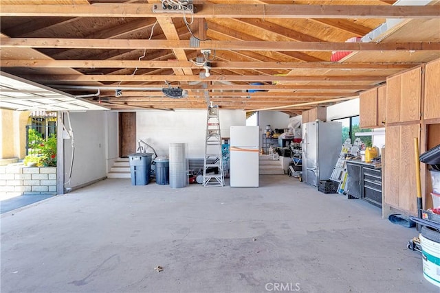 19678 Red Feather Rd, Apple Valley, CA 92307 - garage with freestanding refrigerator