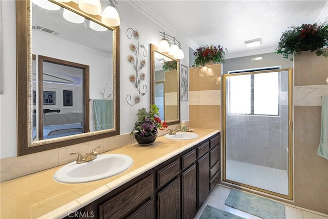 19678 Red Feather Rd, Apple Valley, CA 92307 - full bath with double vanity, a tile shower, crown molding, and tile patterned flooring