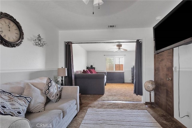 19678 Red Feather Rd, Apple Valley, CA 92307 - living room featuring a ceiling fan and carpet floors