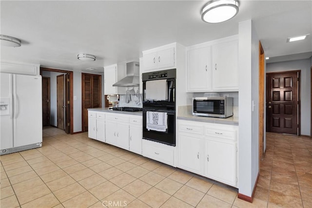 19678 Red Feather Rd, Apple Valley, CA 92307 - kitchen with black appliances, wall chimney range hood, white cabinetry, light countertops, and light tile patterned floors