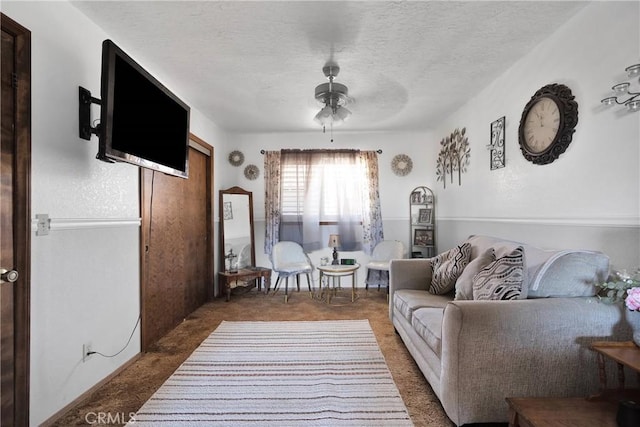 19678 Red Feather Rd, Apple Valley, CA 92307 - carpeted living room with ceiling fan and a textured ceiling