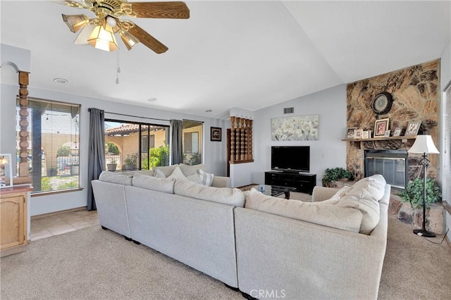 19678 Red Feather Rd, Apple Valley, CA 92307 - living room with light carpet, lofted ceiling, a ceiling fan, and a fireplace