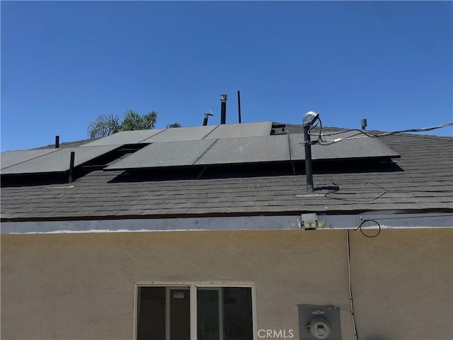1012 Feliz Dr, Bakersfield, CA 93307 - exterior view of a shingled roof and stucco siding
