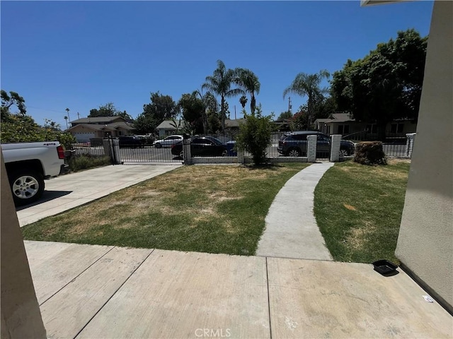 1012 Feliz Dr, Bakersfield, CA 93307 - fenced front yard featuring a gate and concrete driveway