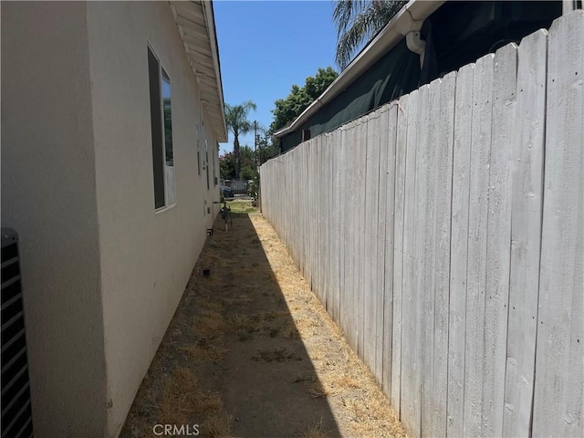 1012 Feliz Dr, Bakersfield, CA 93307 - view of side of home featuring stucco siding