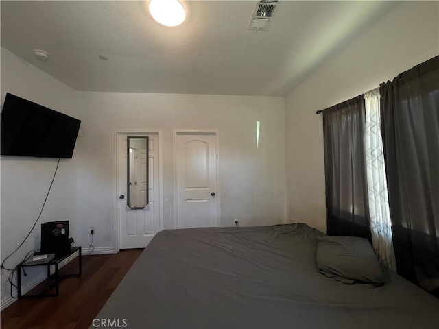 1012 Feliz Dr, Bakersfield, CA 93307 - bedroom with dark wood-style floors and baseboards