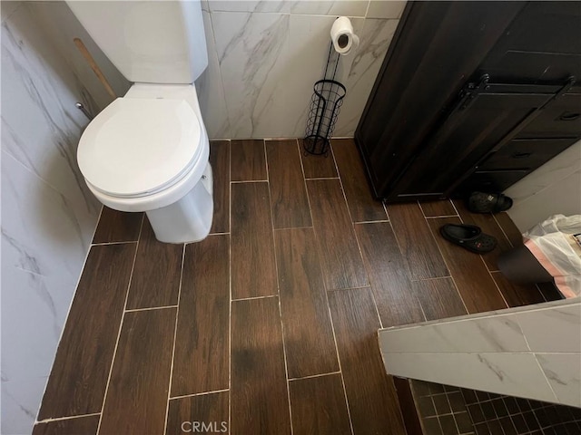 1012 Feliz Dr, Bakersfield, CA 93307 - bathroom with wood finished floors and toilet
