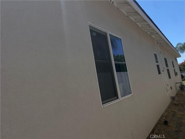 1012 Feliz Dr, Bakersfield, CA 93307 - view of side of property with stucco siding