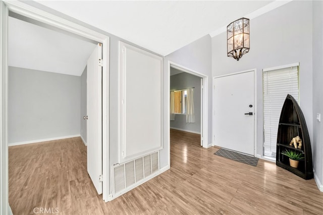 24812 Leto Cir, Mission Viejo, CA 92691 - entryway with light wood-style floors, a chandelier, and lofted ceiling