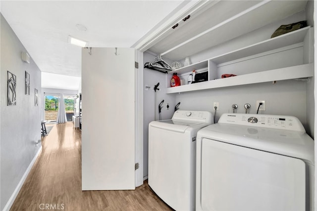 24812 Leto Cir, Mission Viejo, CA 92691 - washroom with washer and dryer and light wood-style flooring