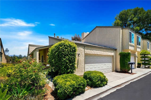 24812 Leto Cir, Mission Viejo, CA 92691 - view of home's exterior featuring driveway, a garage, and stucco siding