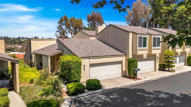 24812 Leto Cir, Mission Viejo, CA 92691 - townhome / multi-family property with stucco siding, roof with shingles, concrete driveway, and a chimney