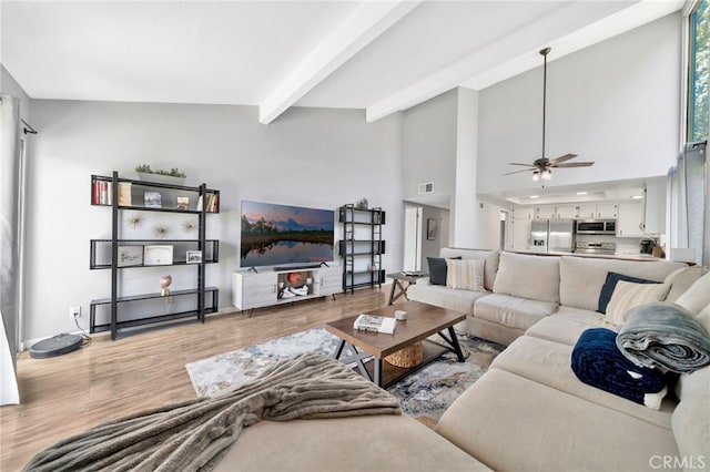 24812 Leto Cir, Mission Viejo, CA 92691 - living area featuring wood finished floors, a ceiling fan, beam ceiling, and a towering ceiling
