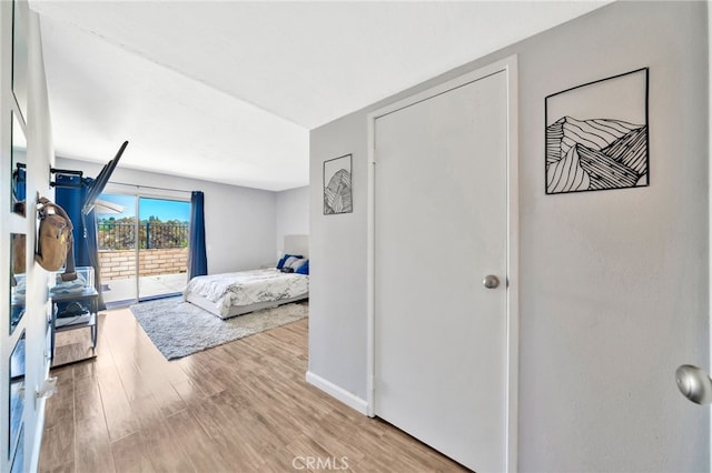 24812 Leto Cir, Mission Viejo, CA 92691 - bedroom with access to outside and light wood-type flooring
