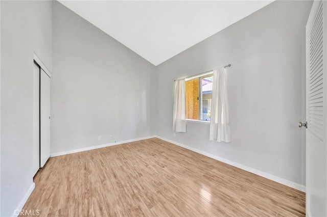 24812 Leto Cir, Mission Viejo, CA 92691 - empty room featuring light wood-type flooring and high vaulted ceiling