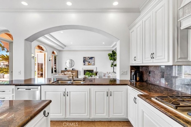 5 Marbella, Dana Point, CA 92629 - kitchen with appliances with stainless steel finishes, arched walkways, open floor plan, crown molding, and white cabinetry