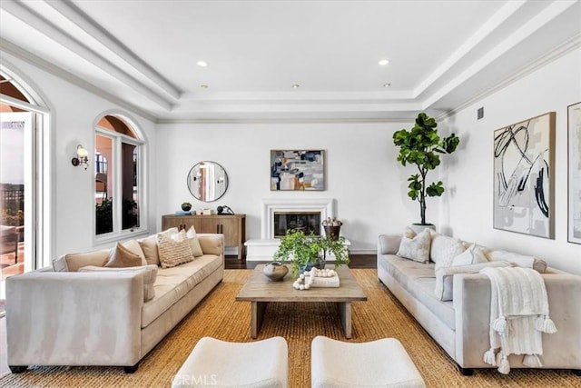 5 Marbella, Dana Point, CA 92629 - living area with a tray ceiling, a glass covered fireplace, healthy amount of natural light, recessed lighting, and ornamental molding