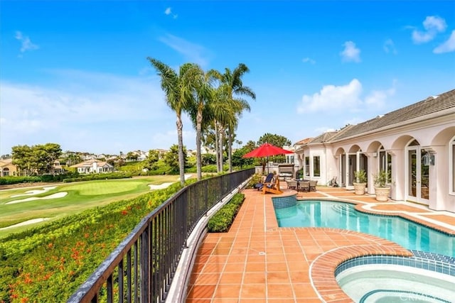 5 Marbella, Dana Point, CA 92629 - view of pool with a patio, view of golf course, a pool with connected hot tub, outdoor dining area, and french doors