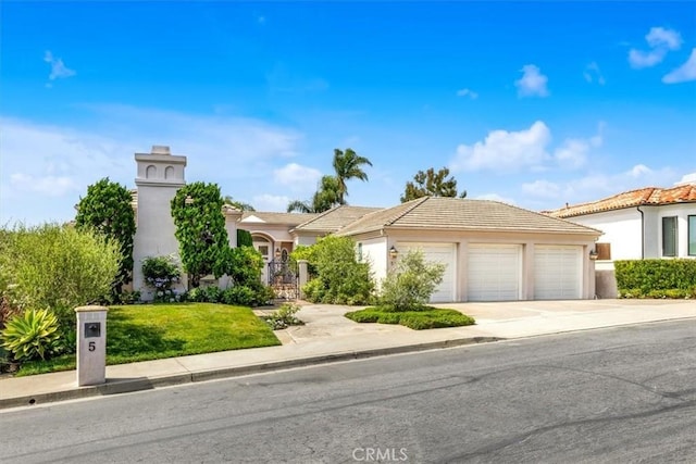 5 Marbella, Dana Point, CA 92629 - view of front of house with concrete driveway, a garage, stucco siding, and a tiled roof