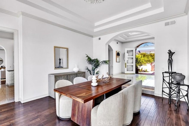 5 Marbella, Dana Point, CA 92629 - dining room featuring arched walkways, a tray ceiling, and wood finished floors