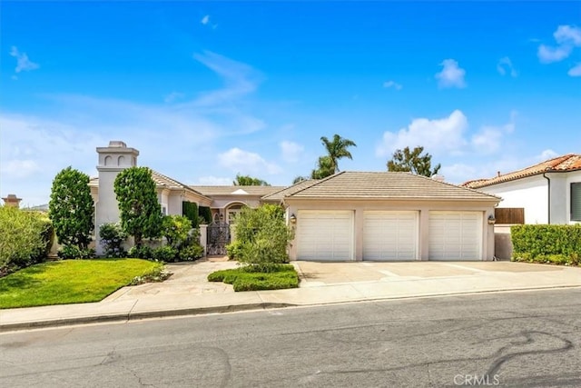 5 Marbella, Dana Point, CA 92629 - view of front of house with an attached garage, concrete driveway, stucco siding, and a tile roof