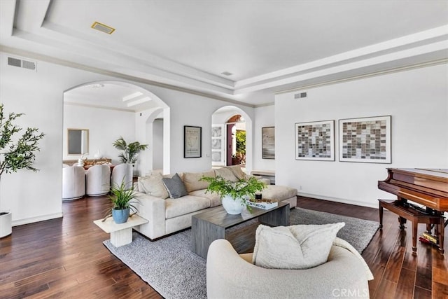5 Marbella, Dana Point, CA 92629 - living room featuring a raised ceiling, dark wood-type flooring, and arched walkways