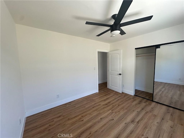 1253 W 65th St, Los Angeles, CA 90044 - unfurnished bedroom with wood finished floors, a closet, and ceiling fan