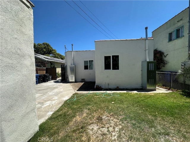 1253 W 65th St, Los Angeles, CA 90044 - rear view of property featuring stucco siding